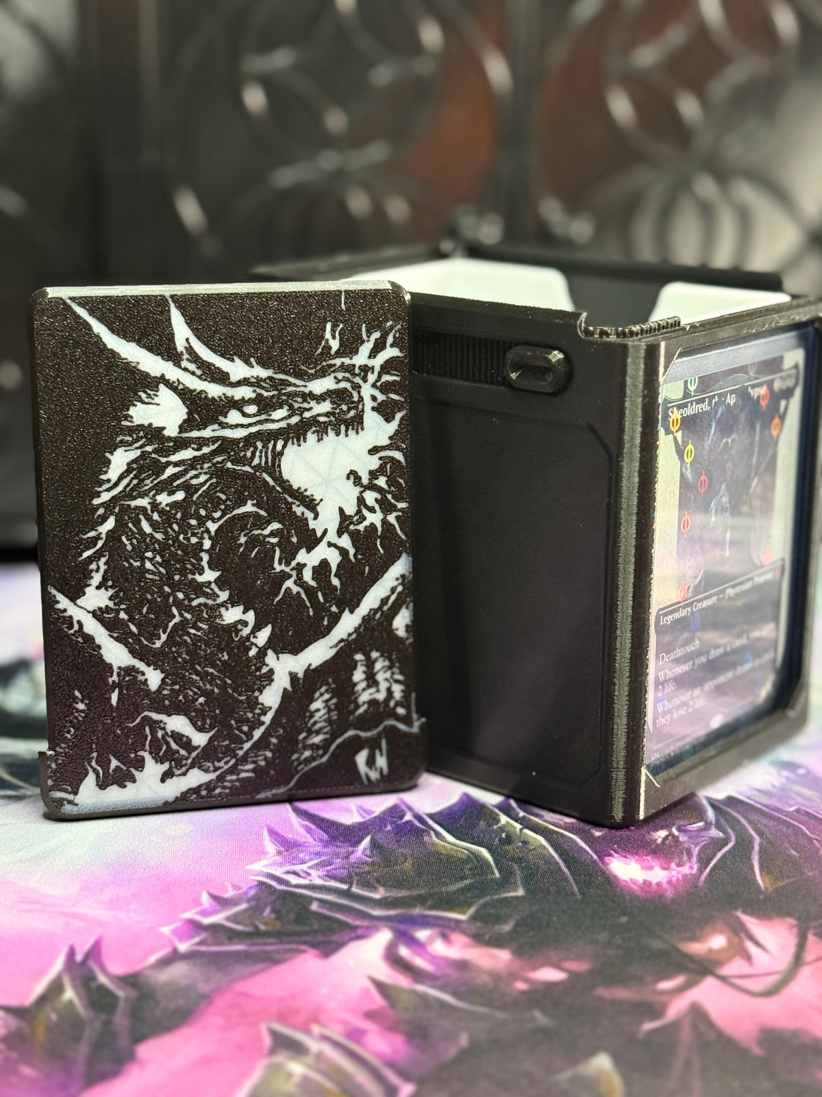 Black deck box with Rin's white dragon artwork on the front panel
