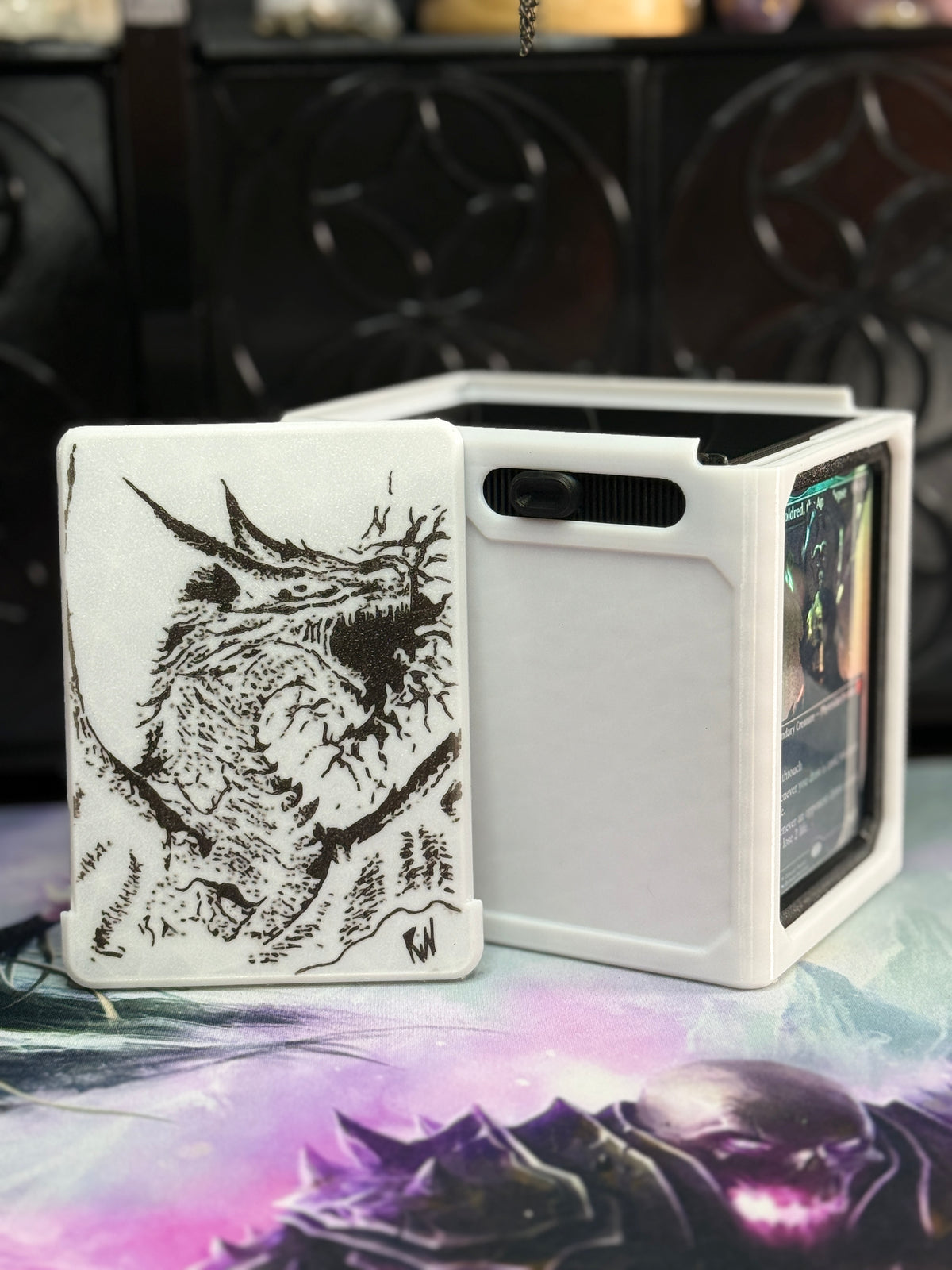 White deck box with black dragon illustration on removable front panel