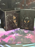 Black and gold wolf relief art panel beside the open deck box