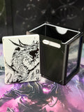 White dragon art panel beside the open black deck box