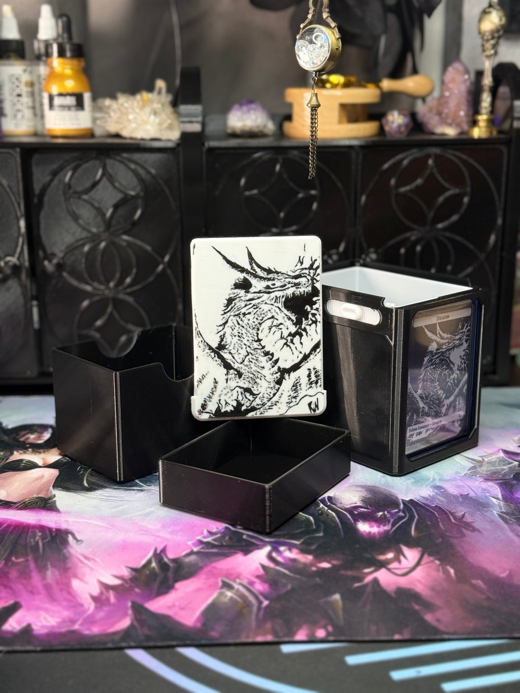 Black dragon deck box with removable art panel and separate containers; display card not included