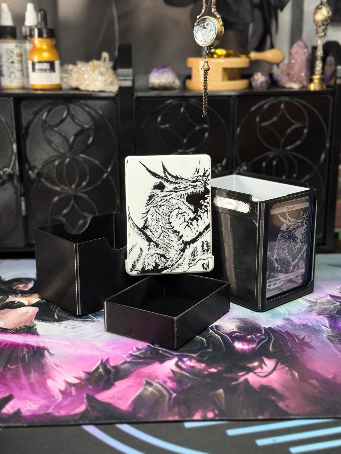 Black dragon deck box with removable art panel and separate containers; display card not included