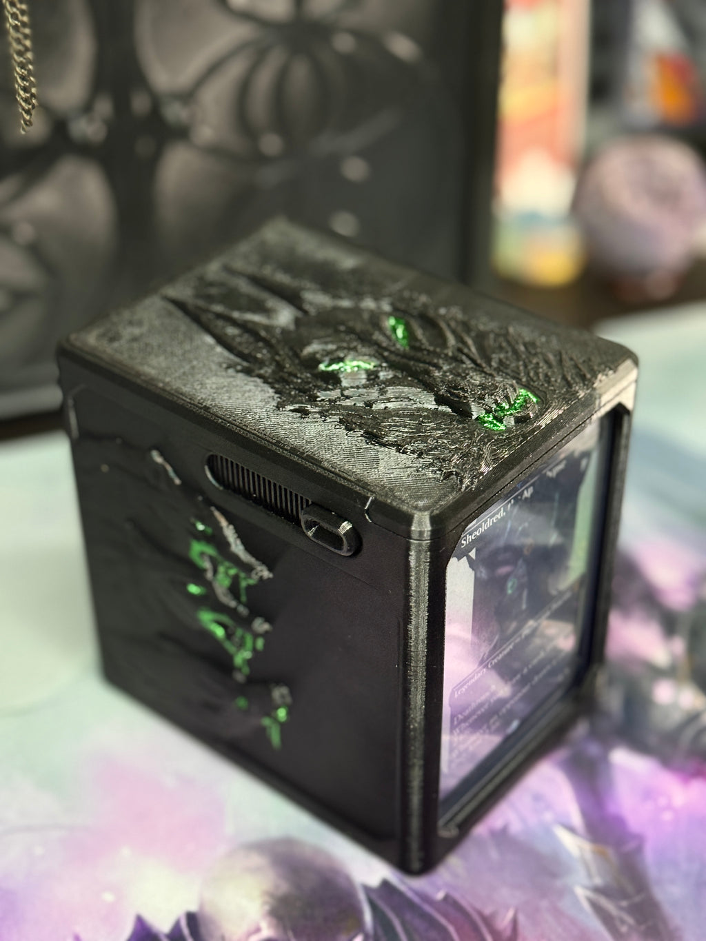Top angle showing raised wolf artwork and green details