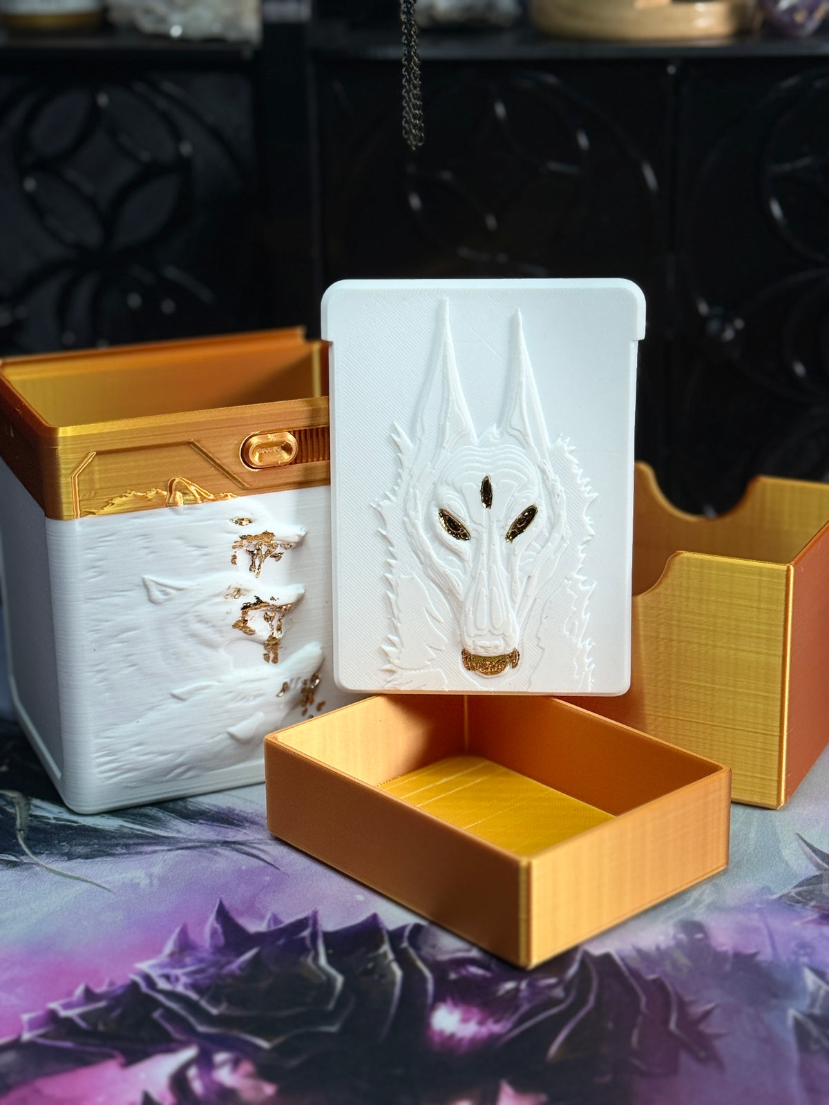 White and gold wolf relief box with separate gold dice container